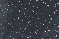 Pink confetti on a gray marble textured background