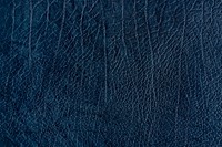 Dark blue creased leather textured background vector