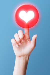 Hand clicking love button psd on social media