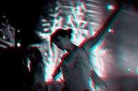 Woman dancing in a music festival in double color exposure effect