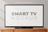 Smart TV screen mockup psd on a wooden table