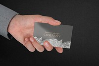 Floral business card mockup psd with businessman&rsquo;s hand