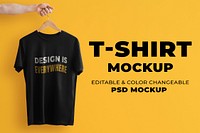 Simple t-shirt mockup psd in black with hand holding hanger