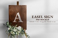 Wedding easel sign mockup psd in wooden texture with flowers