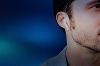 Blue digital background psd man listening to music closeup