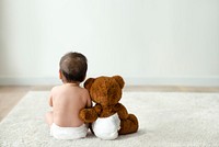 Baby and teddy bear rear view with design space