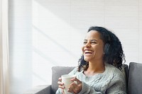 Woman enjoying coffee psd wall with design space