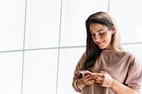 Woman holding smartphone background psd in the office