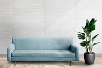 Wall mockup psd with blue sofa in living room