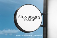 Signboard mockup psd on a wall