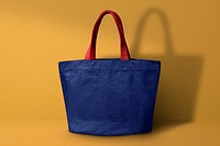 Blue small tote bag on yellow background