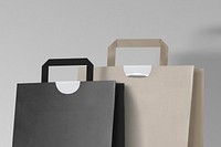 Paper shopping bags on gray background