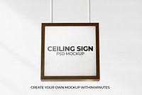 Brown framed sign mockup psd hanging from the ceiling