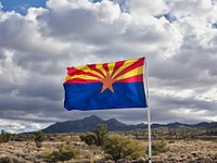 The Arizona state flag flies along old U.S. highway 66 in Mohave County, Arizona.