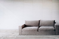 Gray couch against a wall mockup
