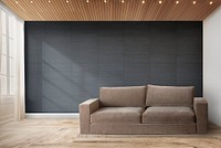 Brown couch against a black wall mockup