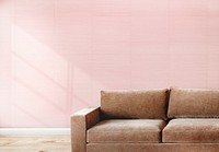 Brown couch against a pink wall mockup