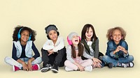 Group of Children Studio Smiling Wearing Headphones and Winter Clothes