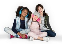 Group of Little Girls Studio Smiling Wearing Headphones and Winter Clothes