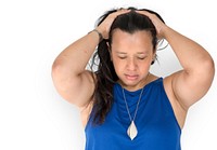 Portrait of a woman holding her hair looking stressed out