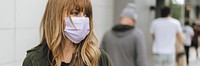 Woman with a face mask in public during coronavirus outbreak