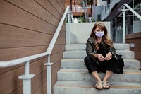 Woman with a face mask in public during coronavirus outbreak