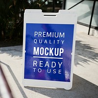 White floor stand sign mockup outside a restaurant