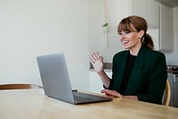 Businesswoman having a video conference with colleagues during coronavirus quarantine