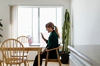 Cheerful woman in a video call while working from home during coronavirus pandemic