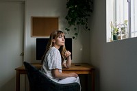 Woman sitting in front of a computer during coronavirus quarantine