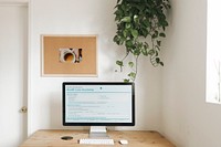 Computer mockup on a wooden table for work from home during corona outbreak