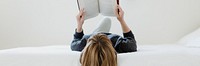 Woman reading a book at home during coronavirus outbreak 