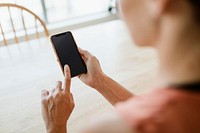 Woman using a mobile phone mockup during coronavirus quarantine