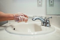 Woman washing her hands with soap during coronavirus pandemic