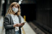 Woman wearing a mask while waiting for the train during the coronavirus pandemic 