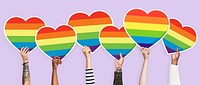 Hands holding a lgbt rainbow heart graphic