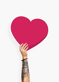 Hand holding a heart cardboard prop