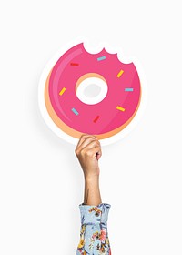 Hand holding a donut cardboard prop