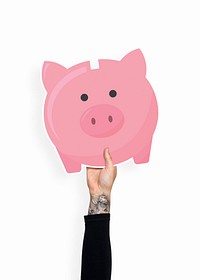 Hand holding a piggy bank cardboard prop