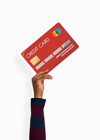 Hand holding a credit card cardboard prop