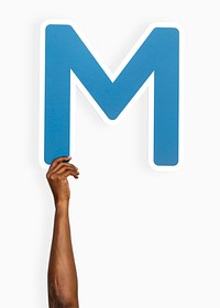 Hand holding the letter M