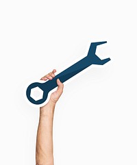 Hand holding a wrench tool
