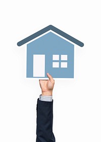 Hand holding a house icon clipart