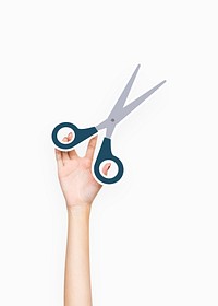 Hand holding a pair of scissors
