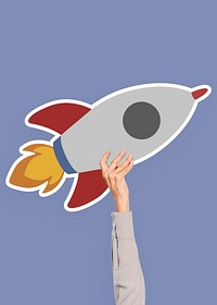 Hand holding a spaceship rocket clipart