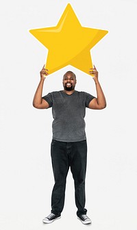 Cheerful man holding a golden star rating symbol