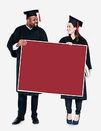 Female and male grad holding a copy space