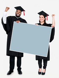 Female and male grad holding a copy space
