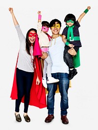 Happy family wearing superhero costumes