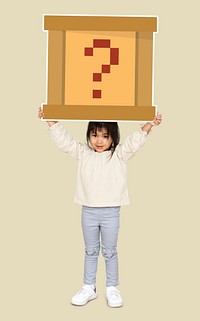 Little girl holding a question box
